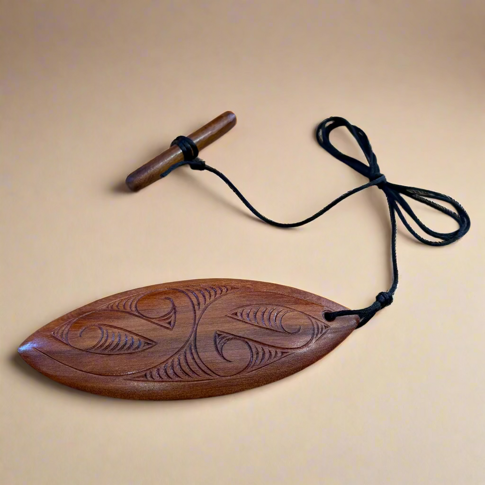Pūrerehua (Toggle) - Nā James Davidson of Carve It